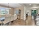 Bright dining room with large windows, hardwood floors, and stylish seating for Gathering meals at 3762 White Rose Loop, Castle Rock, CO 80108