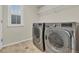 A clean laundry room features a front-loading washer and dryer at 3762 White Rose Loop, Castle Rock, CO 80108