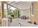Cozy outdoor patio with a grill, dining area, and a pergola, ideal for outdoor gatherings at 3762 White Rose Loop, Castle Rock, CO 80108