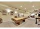 Spacious finished basement featuring a pool table, and entertainment area at 6943 Saddleback Ave, Firestone, CO 80504