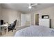Comfortable bedroom featuring neutral walls, ceiling fan and closet to the side at 6943 Saddleback Ave, Firestone, CO 80504