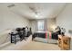 Cozy bedroom with ceiling fan, a window, and a black desk area at 6943 Saddleback Ave, Firestone, CO 80504