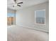 Bedroom featuring sliding door access to the backyard and a large picture window at 2214 Alyssa St, Fort Lupton, CO 80621
