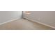 Bright bedroom featuring neutral carpeting, light gray walls, and a window for natural light at 2214 Alyssa St, Fort Lupton, CO 80621