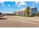 Modern building exterior with expansive windows and landscaped grounds, a perfect blend of style and functionality at 2214 Alyssa St, Fort Lupton, CO 80621