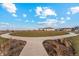 Beautiful community park with a walking path, green space and covered picnic area on a sunny day at 2214 Alyssa St, Fort Lupton, CO 80621