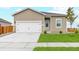 Charming single Gathering home featuring a manicured lawn and two car garage at 2214 Alyssa St, Fort Lupton, CO 80621