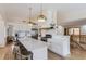 Bright eat-in kitchen features a large island, hardwood floors and modern, stainless steel appliances at 2066 E 129Th Ave, Thornton, CO 80241