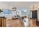 Inviting living room featuring hardwood floors, vaulted ceilings, and plentiful light at 2066 E 129Th Ave, Thornton, CO 80241