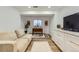 Cozy living room features built in wet bar, modern flooring, and lots of natural light at 2066 E 129Th Ave, Thornton, CO 80241