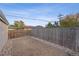 Small backyard with gravel landscaping and wooden fence at 3608 N Grape St, Denver, CO 80207