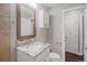 Bright bathroom with granite countertop and updated fixtures at 3608 N Grape St, Denver, CO 80207