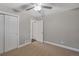 Spacious bedroom with ceiling fan and double closets at 3608 N Grape St, Denver, CO 80207