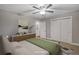 Virtually staged bedroom with double door closet and ceiling fan at 3608 N Grape St, Denver, CO 80207