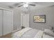 Virtually staged bedroom with ceiling fan and double closets at 3608 N Grape St, Denver, CO 80207