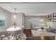 Virtually staged dining area with modern table and chairs at 3608 N Grape St, Denver, CO 80207