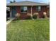 Cute brick ranch home with a blue door at 3608 N Grape St, Denver, CO 80207