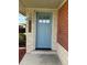 Light blue front door with a wood number plaque at 3608 N Grape St, Denver, CO 80207