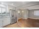 Modern kitchen with stainless steel appliances and granite counters at 3608 N Grape St, Denver, CO 80207