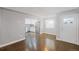 Hardwood floors and an open concept kitchen in this bright living area at 3608 N Grape St, Denver, CO 80207