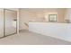 Upstairs bedroom with view of lower level and sliding closet doors at 3260 47Th St # 201A, Boulder, CO 80301