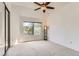 Bright bedroom with a ceiling fan, a large window, neutral carpet, and ample natural light at 3260 47Th St # 201A, Boulder, CO 80301