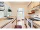 Kitchen featuring wood floors and view through to a dining area and outdoor view at 3260 47Th St # 201A, Boulder, CO 80301