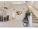 Open-concept living space with a dining area, staircase, and pass-through to the kitchen at 3260 47Th St # 201A, Boulder, CO 80301