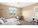 Sunlit bedroom with large window and view of greenery at 22268 E Hidden Trail Dr, Parker, CO 80138