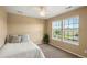 Cozy bedroom with natural light and a view of the outdoors at 22268 E Hidden Trail Dr, Parker, CO 80138