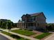 Charming two-story home boasts a stone facade, covered front porch, and well-manicured lawn at 22268 E Hidden Trail Dr, Parker, CO 80138
