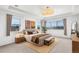Serene main bedroom with tray ceiling, a king-size bed, and large windows offering scenic views at 22268 E Hidden Trail Dr, Parker, CO 80138