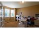 Cozy home office with neutral tones, a large window, and storage for an organized workspace at 22268 E Hidden Trail Dr, Parker, CO 80138