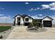 Stunning two-story home boasting a contemporary design, ample parking, and meticulously manicured landscaping at 13350 Imboden Rd, Hudson, CO 80642