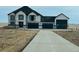 Beautiful two-story home boasting a contemporary design and large driveway with garage at 13350 Imboden Rd, Hudson, CO 80642