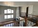 Spacious living room with fireplace, hardwood floors, and plenty of natural light from oversized windows at 13350 Imboden Rd, Hudson, CO 80642