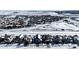 Aerial view of homes in a snowy, residential neighborhood at 5808 S Duquesne Ct, Aurora, CO 80016