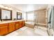 Elegant bathroom with double vanity, soaking tub, and shower at 5808 S Duquesne Ct, Aurora, CO 80016