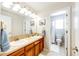 Clean bathroom with double sinks and a shower/tub combo at 5808 S Duquesne Ct, Aurora, CO 80016