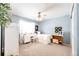 Charming bedroom with light blue walls and built-in shelving at 5808 S Duquesne Ct, Aurora, CO 80016