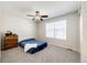 Simple bedroom with a ceiling fan and carpeted floor at 5808 S Duquesne Ct, Aurora, CO 80016