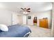 Bright bedroom featuring a ceiling fan and plenty of space at 5808 S Duquesne Ct, Aurora, CO 80016