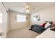 Cozy bedroom with window and ceiling fan at 5808 S Duquesne Ct, Aurora, CO 80016