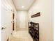 Inviting entryway with tile flooring and shoe storage at 5808 S Duquesne Ct, Aurora, CO 80016