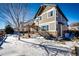 Two-story house with snow covered yard and pergola at 5808 S Duquesne Ct, Aurora, CO 80016