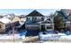 Two-story house with attached garage and snowy front yard at 5808 S Duquesne Ct, Aurora, CO 80016