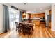 Bright kitchen with wood cabinets, stainless steel appliances, and hardwood floors at 5808 S Duquesne Ct, Aurora, CO 80016