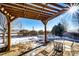 Covered patio with seating area, perfect for outdoor dining at 5808 S Duquesne Ct, Aurora, CO 80016