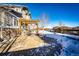 Covered patio with seating area and pergola at 5808 S Duquesne Ct, Aurora, CO 80016