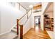 Elegant staircase with wooden railings and carpeting, leading to an upper floor at 5808 S Duquesne Ct, Aurora, CO 80016